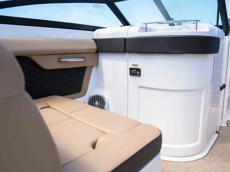 Slide: The Image of Interior of a 2018 Sea Ray SDX 270 boat with beige seating. - 13