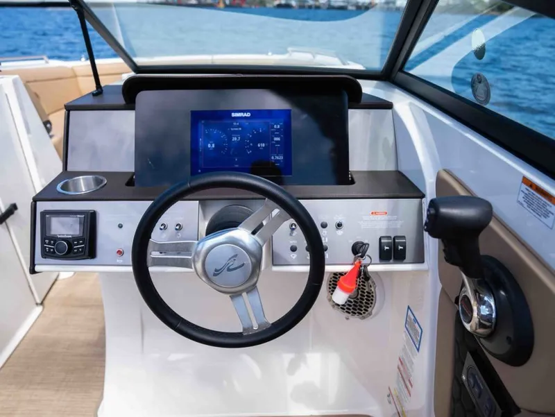 Slide: The Image of 2018 Sea Ray SDX 270 helm with Simrad display and controls. - 15