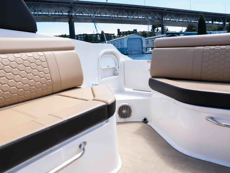 Slide: The Image of Interior of a 2018 Sea Ray SDX 270 with cushioned seating. - 17