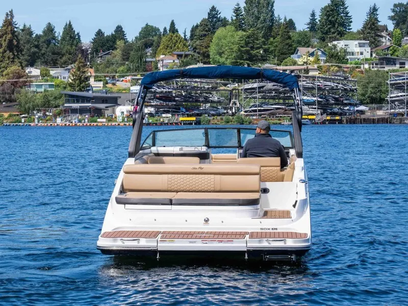 Slide: The Image of 2018 Sea Ray SDX 270 boat on a tranquil lake. - 3