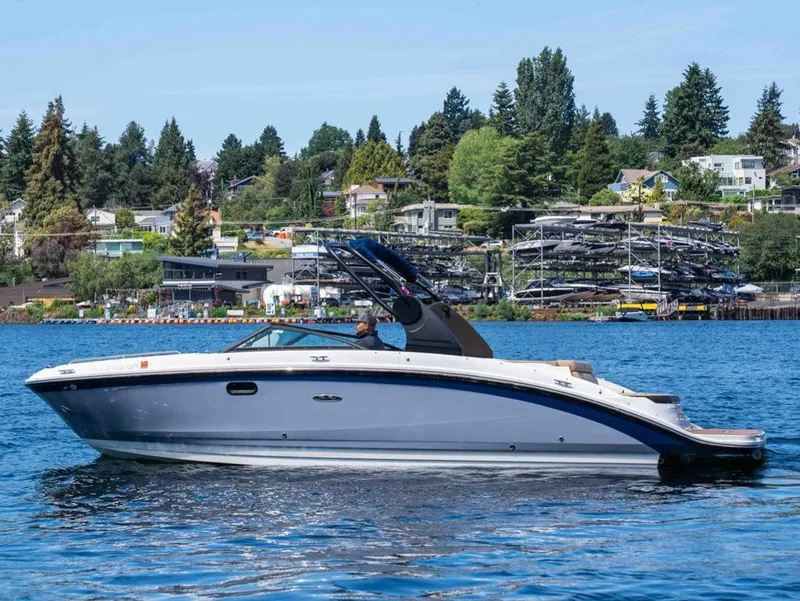 Slide: The Image of 2018 Sea Ray SDX 270 boat on a tranquil lake. - 5