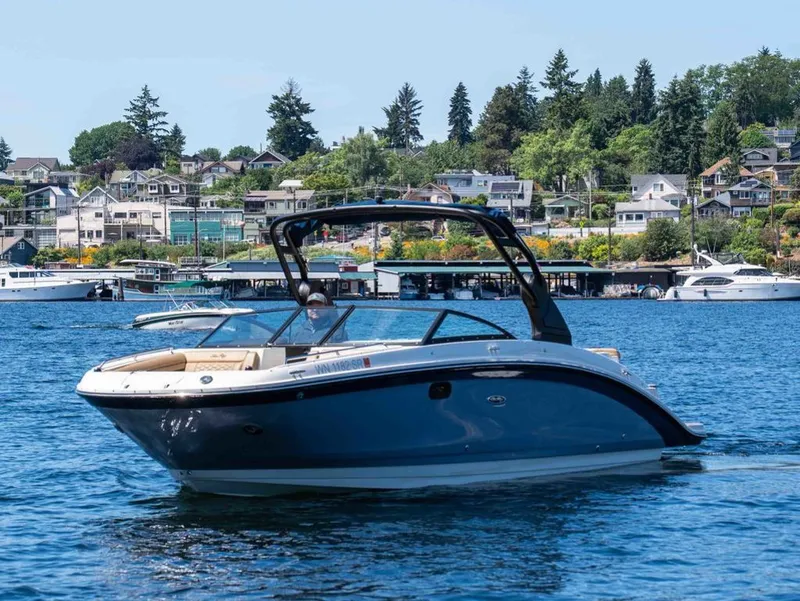Slide: The Image of 2018 Sea Ray SDX 270 boat on a tranquil lake. - 6