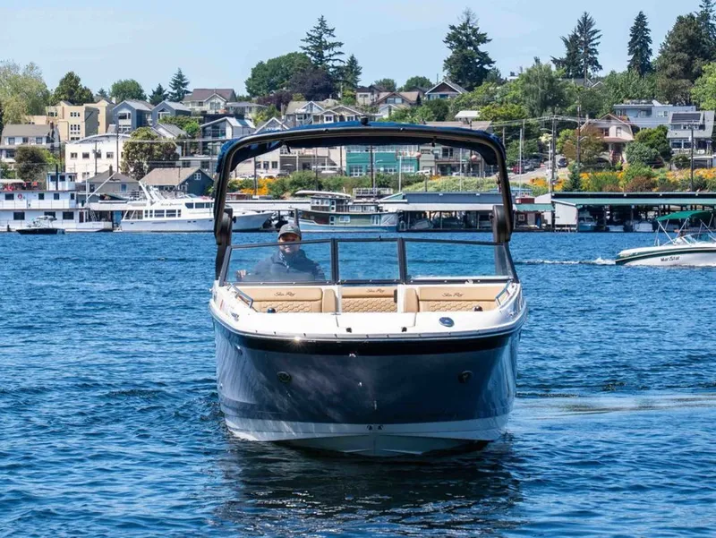 Slide: The Image of 2018 Sea Ray SDX 270 boat on a tranquil lake. - 7