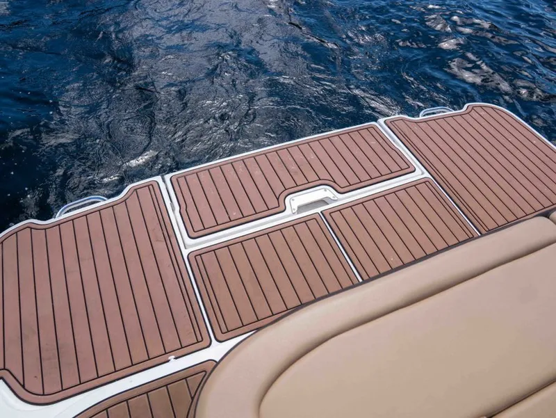 Slide: The Image of Sea Ray SDX 270 2018 with teak deck by the water. - 8
