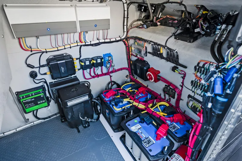 Slide: The Image of Electrical system setup featuring batteries and wiring. - 29