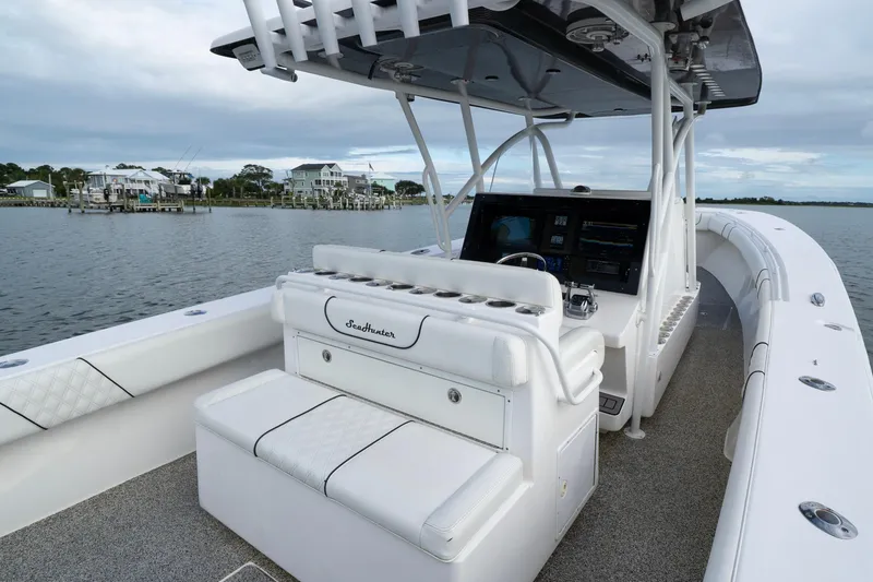 Slide: The Image of 2012 SeaHunter 37 Tournament boat interior with helm, seating, and water view. - 9