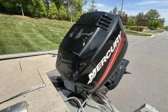 Slide: The Image of 2005 Tracker Tournament V-18 All Fish boat with Mercury outboard motor on a trailer. - 10