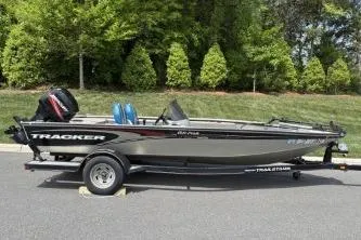 Slide: The Image of 2005 Tracker Tournament V-18 All Fish boat on trailer, parked outdoors. - 11