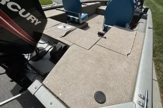 Slide: The Image of 2005 Tracker Tournament V-18 All Fish boat interior with seating and storage compartments. - 8