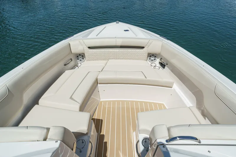Slide: The Image of Luxurious seating area on the 2026 Tiara Yachts 34 LX, overlooking serene waters. - 17