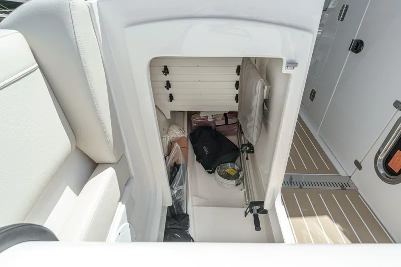 Slide: The Image of Storage compartment in 2026 Tiara Yachts 34 LX, featuring organized interior space. - 19