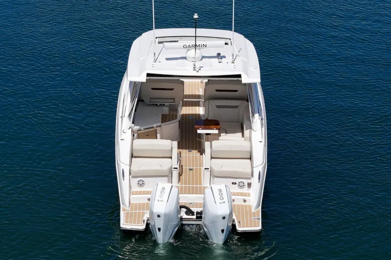 Slide: The Image of 2026 Tiara Yachts 34 LX luxury boat with twin engines on calm water. - 25