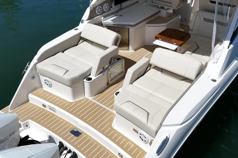 Slide: The Image of 2026 Tiara Yachts 34 LX luxury boat interior with plush seating and elegant design. - 27