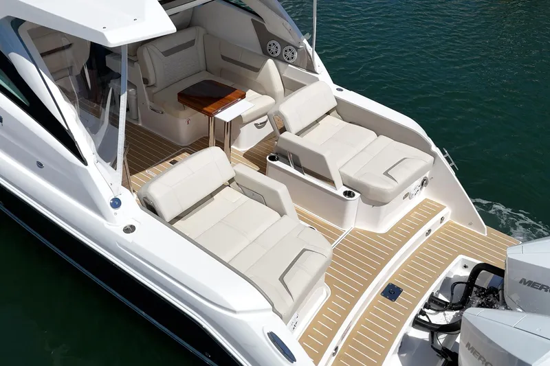 Slide: The Image of 2026 Tiara Yachts 34 LX luxury boat interior with plush seating and elegant design. - 28