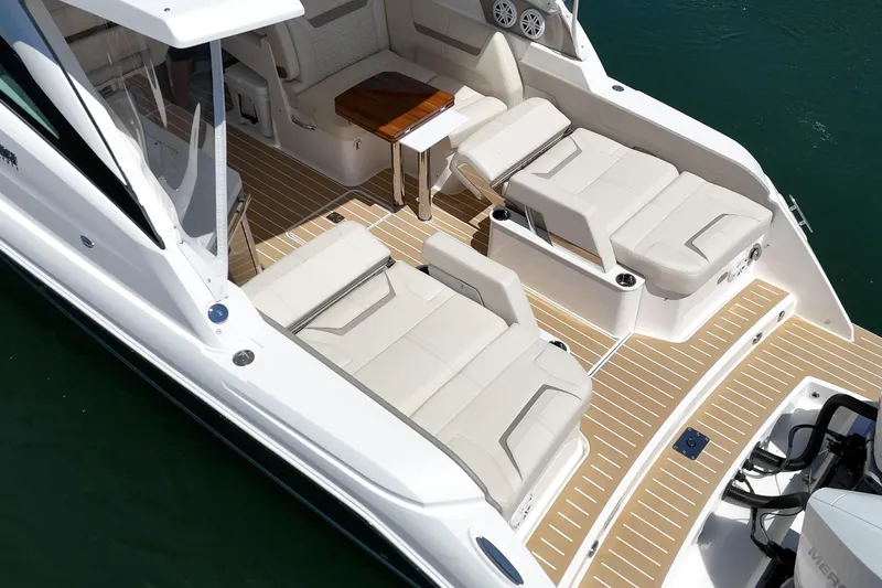 Slide: The Image of Luxurious 2026 Tiara Yachts 34 LX with elegant seating and teak flooring on deck. - 29