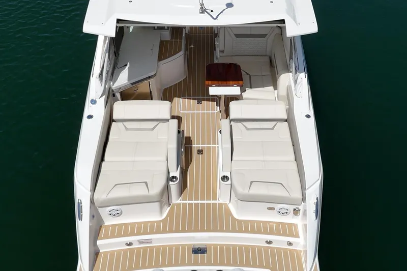Slide: The Image of 2026 Tiara Yachts 34 LX luxury boat interior with elegant seating and wooden flooring. - 31