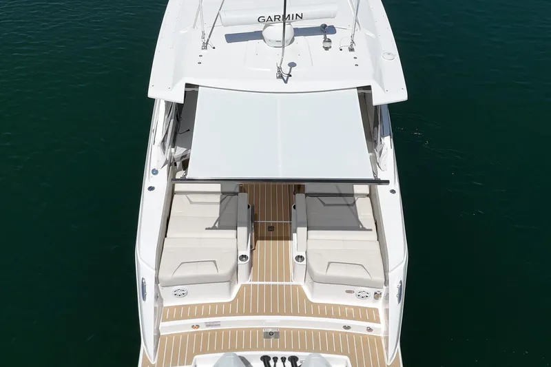 Slide: The Image of 2026 Tiara Yachts 34 LX with sunshade, aerial view on water. - 32