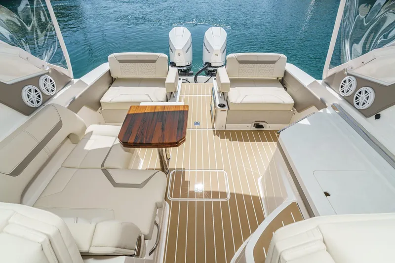 Slide: The Image of Luxurious 2026 Tiara Yachts 34 LX interior with elegant seating and wooden table on deck. - 34