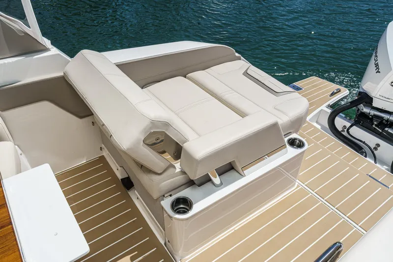 Slide: The Image of 2026 Tiara Yachts 34 LX boat with beige seating and sleek deck design. - 37