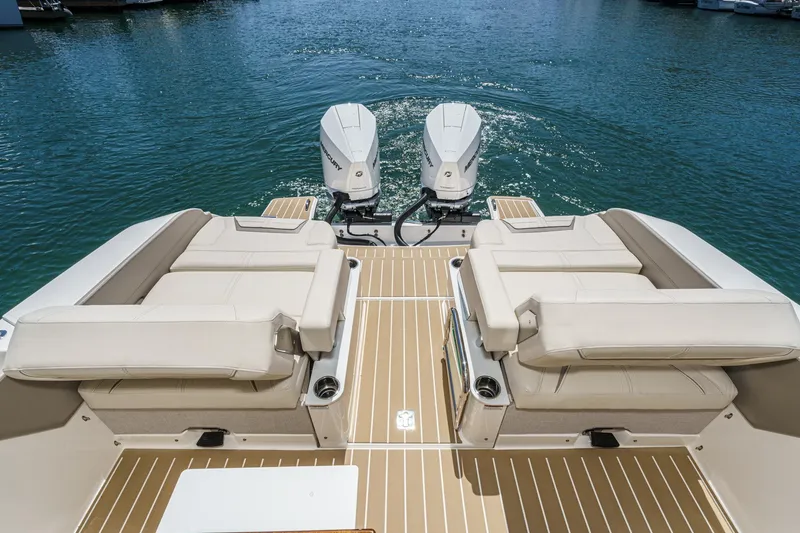 Slide: The Image of 2026 Tiara Yachts 34 LX with twin outboard engines on calm water. - 38