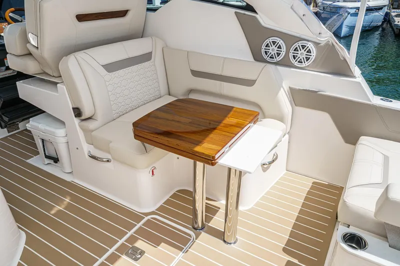 Slide: The Image of Luxurious seating area on 2026 Tiara Yachts 34 LX with wooden table and elegant design. - 42