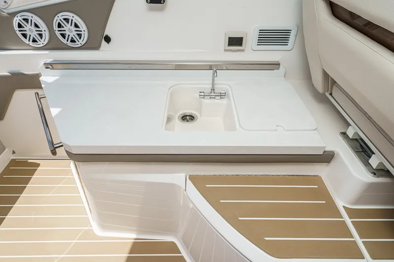 Slide: The Image of 2026 Tiara Yachts 34 LX interior with sleek sink and modern design. - 43