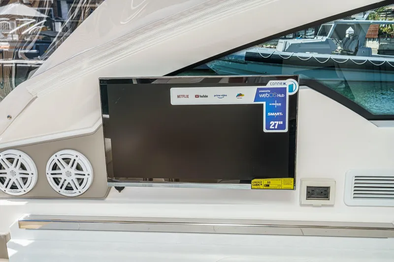 Slide: The Image of 2026 Tiara Yachts 34 LX featuring a 27-inch smart TV with streaming services. - 44