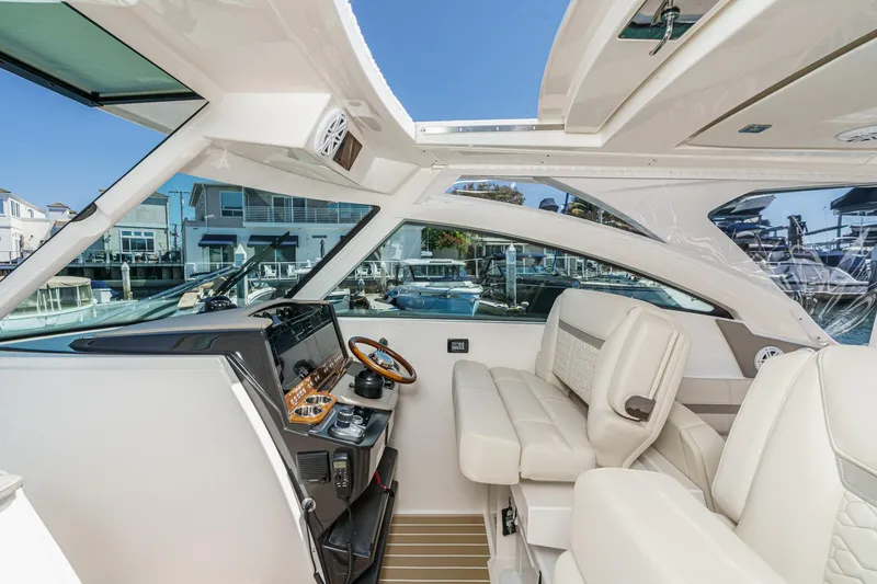 Slide: The Image of Luxurious interior of 2026 Tiara Yachts 34 LX, featuring elegant seating and modern controls. - 50