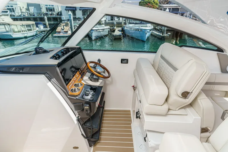 Slide: The Image of 2026 Tiara Yachts 34 LX helm with luxurious seating and modern controls. - 52