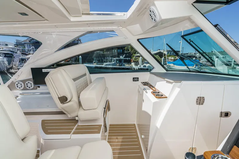Slide: The Image of Interior of 2026 Tiara Yachts 34 LX, featuring luxurious seating and modern design. - 54