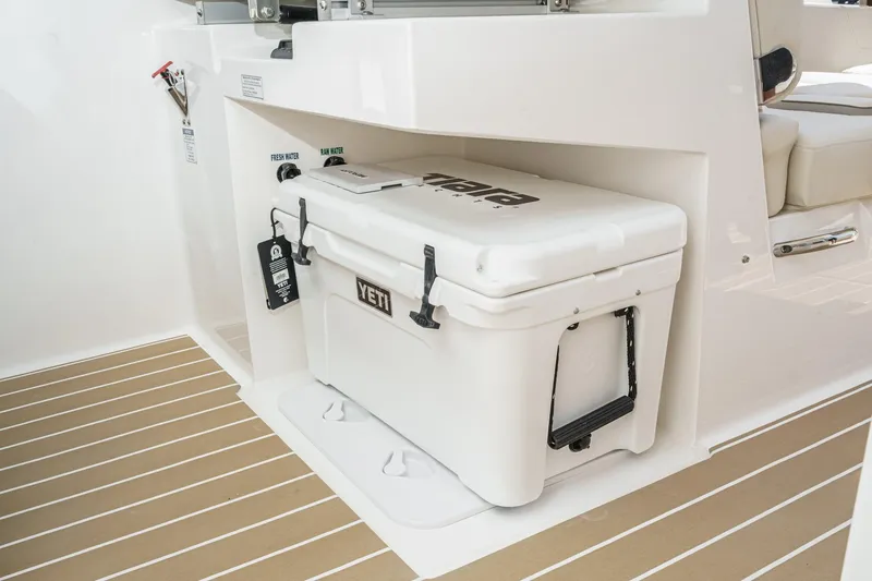 Slide: The Image of 2026 Tiara Yachts 34 LX featuring a YETI cooler on deck. - 55