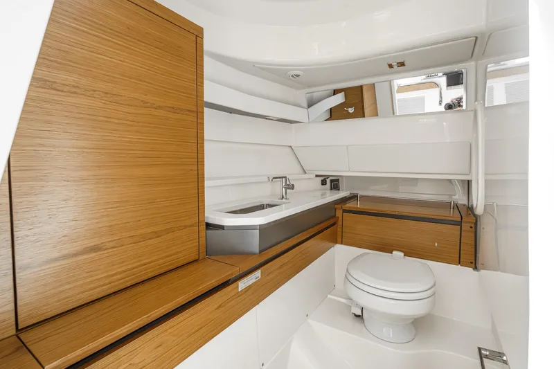 Slide: The Image of Luxurious bathroom interior of 2026 Tiara Yachts 34 LX, featuring modern wood accents. - 58