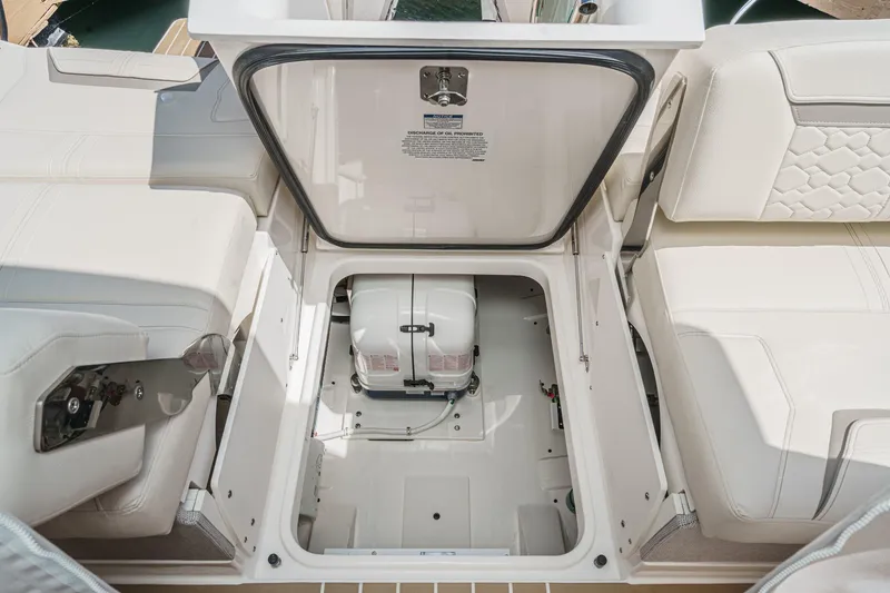 Slide: The Image of 2026 Tiara Yachts 34 LX engine compartment with open hatch, showcasing interior details. - 59