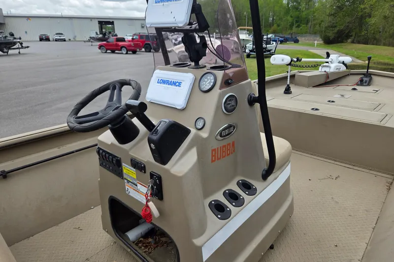 Slide: The Image of 2024 SeaArk 2072 FX boat interior with steering console and Lowrance equipment. - 10