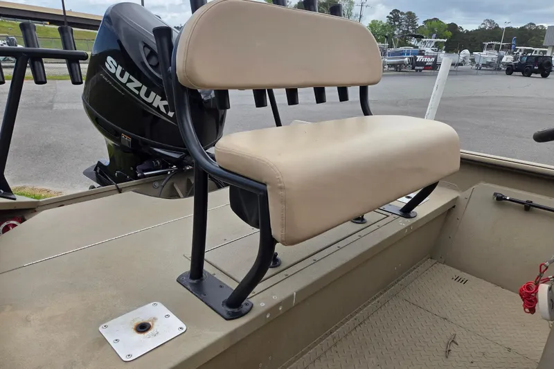 Slide: The Image of 2024 SeaArk 2072 FX boat with Suzuki outboard motor and beige seating. - 11