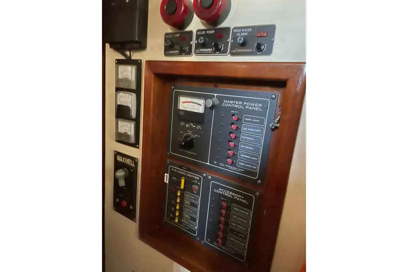 Slide: The Image of Nautical-themed rug in a 1973 CAL 2-46 boat interior with wooden cabinets. - 10