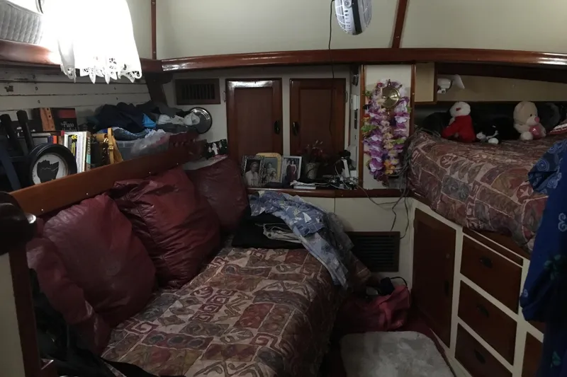 Slide: The Image of Wooden cabinetry with black handles inside a 1973 CAL 2-46 boat. - 13