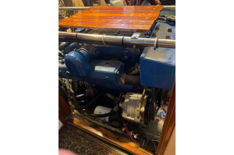 Slide: The Image of Deck of a 1973 CAL 2-46 sailboat with wooden benches and marine equipment. - 16