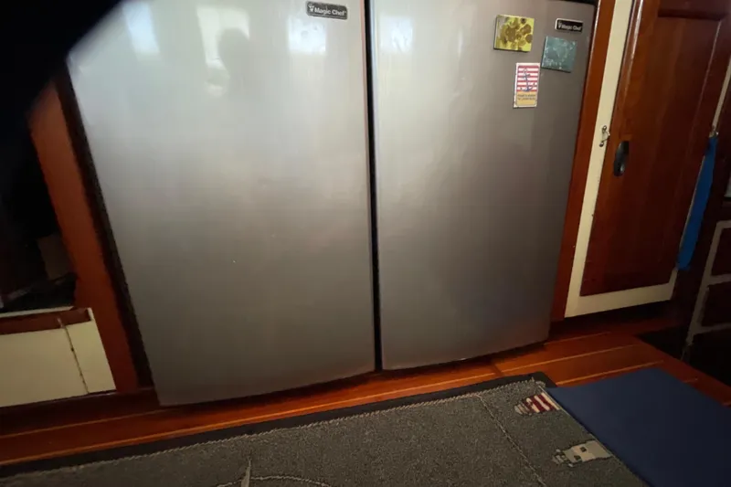 Slide: The Image of Vintage CAL 2-46 stove from 1973 with red kettle and blue towels. - 7