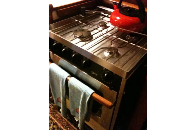 Slide: The Image of Electrical control panel on a 1973 CAL 2-46 boat, featuring gauges and switches. - 9