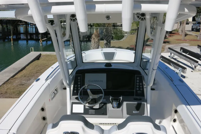 Slide: The Image of 2026 Robalo R250 Center Console boat interior with Garmin navigation system. - 11