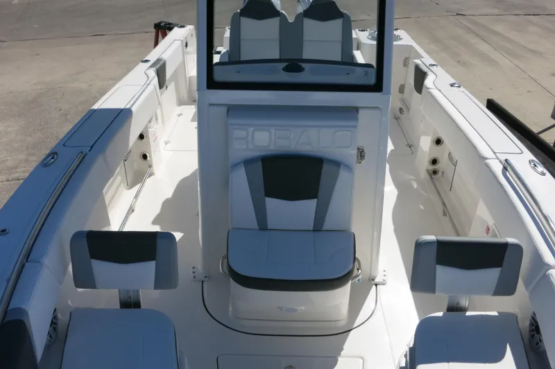 Slide: The Image of 2026 Robalo R250 Center Console boat interior with seating and console view. - 16
