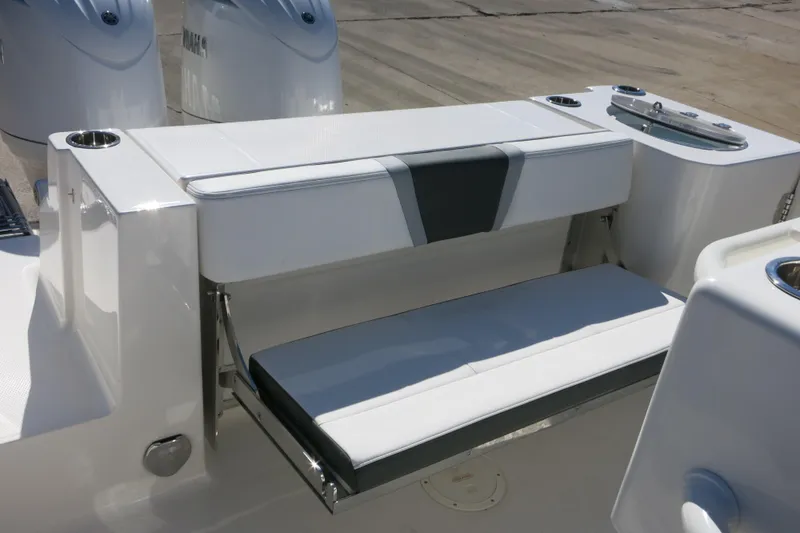 Slide: The Image of 2026 Robalo R250 Center Console boat with foldable seating and sleek design. - 26