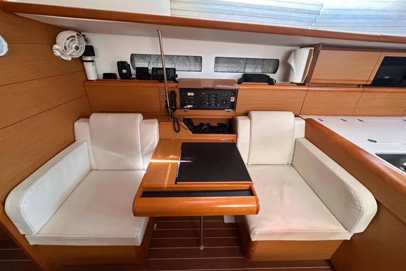 Slide: The Image of Interior of 2015 Jeanneau Sun Odyssey 469 yacht with seating and navigation equipment. - 10