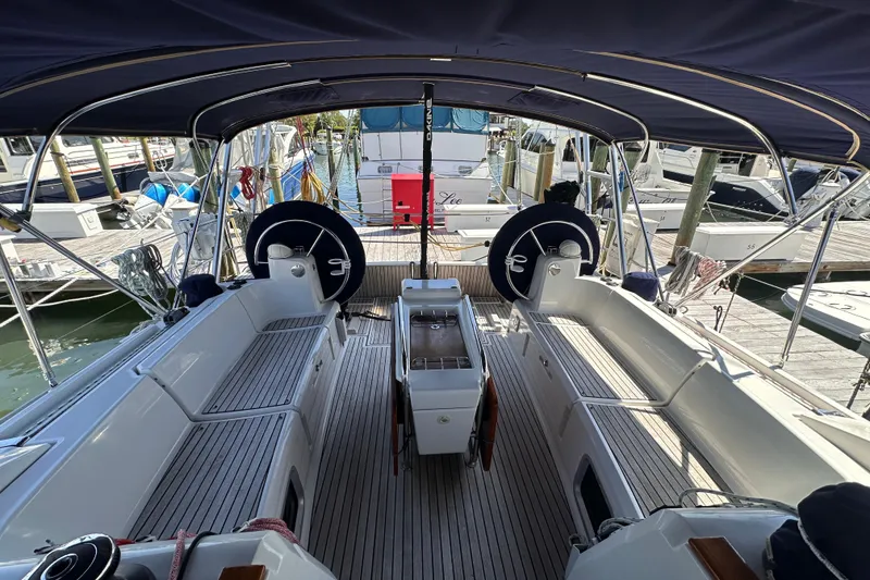 Slide: The Image of Cockpit view of 2015 Jeanneau Sun Odyssey 469 sailboat docked at marina. - 14