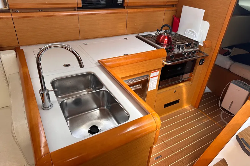 Slide: The Image of Interior of 2015 Jeanneau Sun Odyssey 469 yacht kitchen with sink and stove. - 17