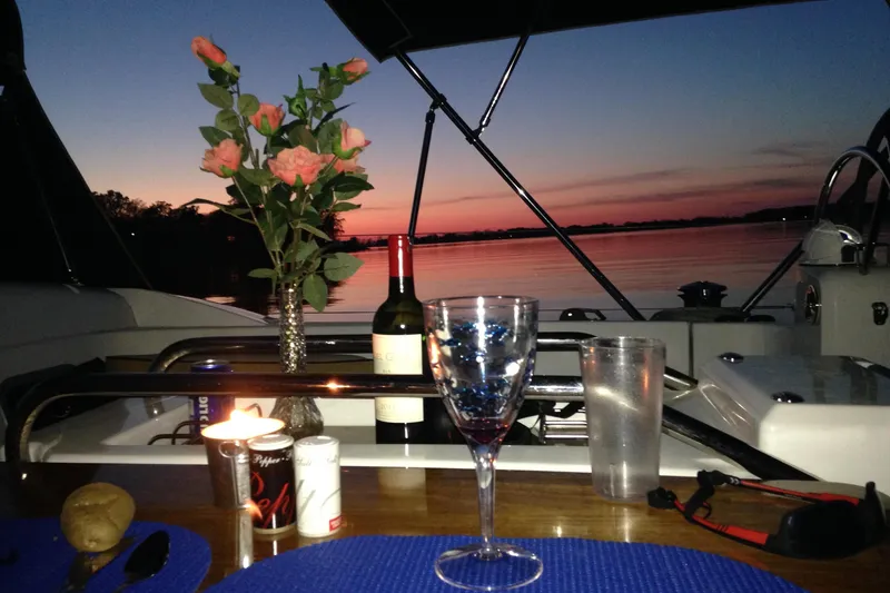 Slide: The Image of Romantic sunset dinner setup on Jeanneau Sun Odyssey 469 yacht, 2015 model. - 2