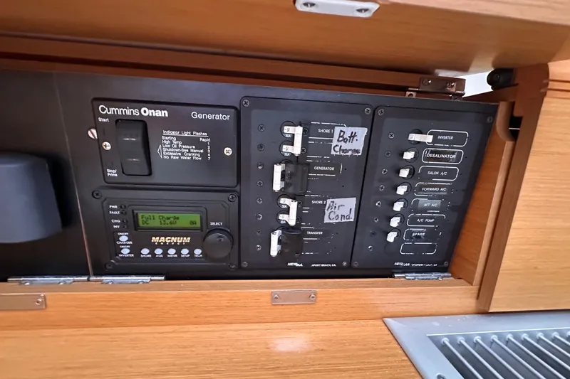 Slide: The Image of Electrical panel of 2015 Jeanneau Sun Odyssey 469 sailboat with Cummins Onan generator controls. - 20