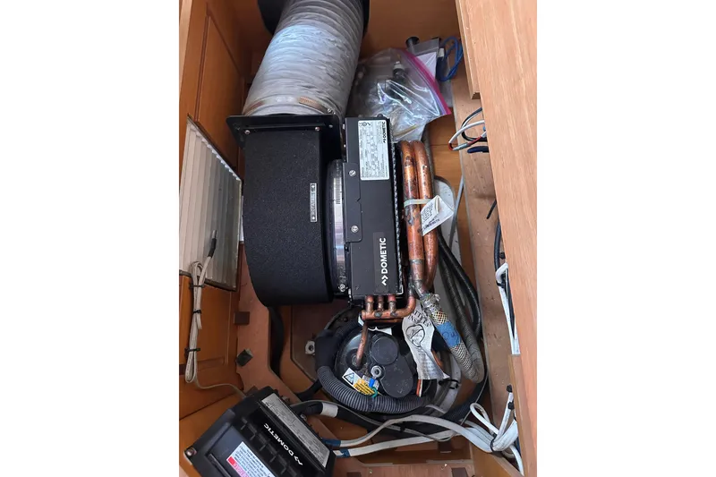 Slide: The Image of Engine compartment of a 2015 Jeanneau Sun Odyssey 469 sailboat, featuring Dometic equipment. - 28