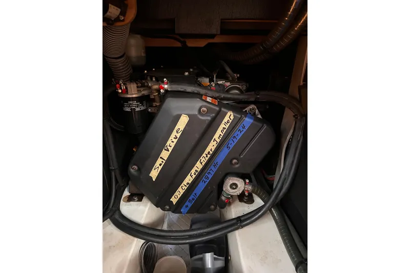 Slide: The Image of Engine compartment of 2015 Jeanneau Sun Odyssey 469 sailboat, featuring labeled components. - 32